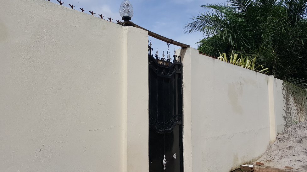 The gate to a house in The Gambia