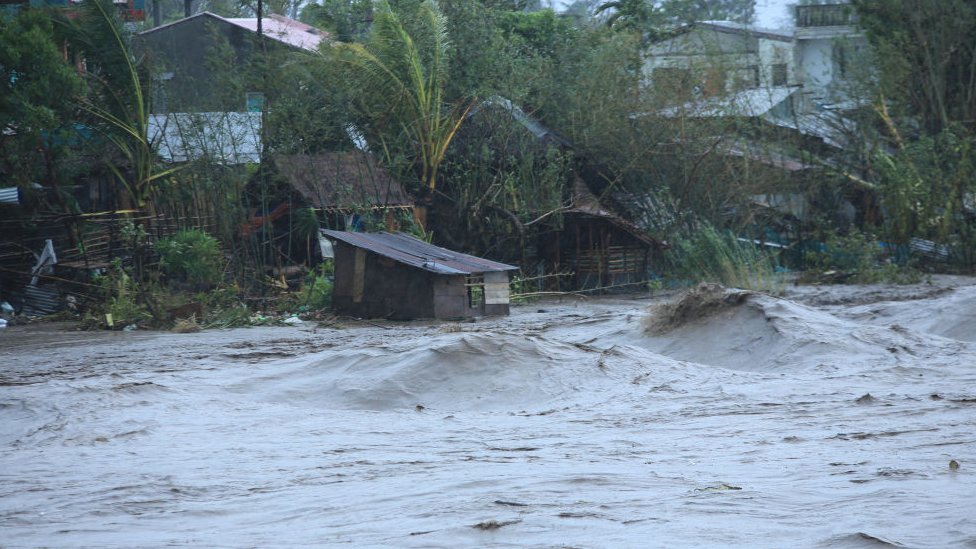 A general view shows a swollen river due to heavy rains brought by Super Typhoon Goni in Legazpi City, Philippines' Abay province on November 1, 2020.