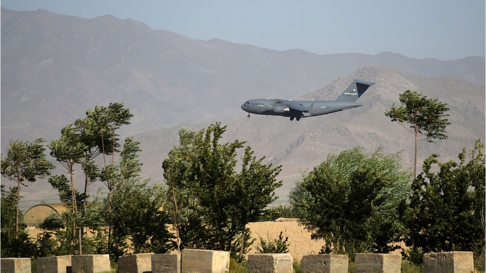 A US Air Force transport plane lands at the Bagram Airfield in Bagram on July 1, 2021