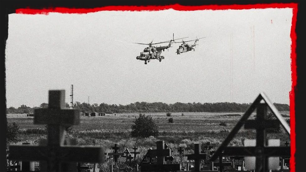 Russian military helicopters flying near a cemetery close to a military airfield outside Taganrog, Rostov in July 2022.