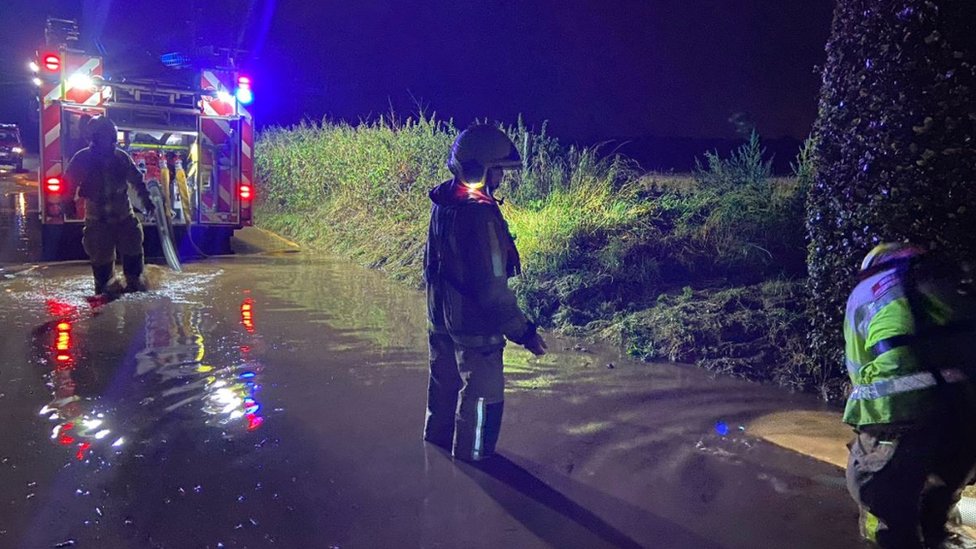 Storm water pours into Asda and McDonald's - BBC News