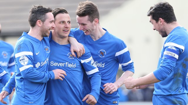 Ballinmallard players celebrate a vital victory over Warrenpoint Town at Ferney Park