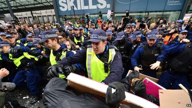 Students and police during a protest calling for the abolition of tuition fees and an end to student debt in Westminster, London