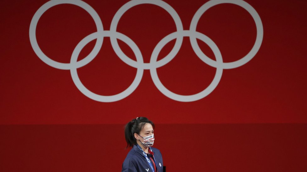 Golden medalist Hsing-Chun Kuo of Chinese Taipei at the podium after the Women"s 59kg Group A competition during the Weightlifting events of the Tokyo 2020 Olympic Games at the Tokyo International Forum in Tokyo, Japan, 27 July 2021