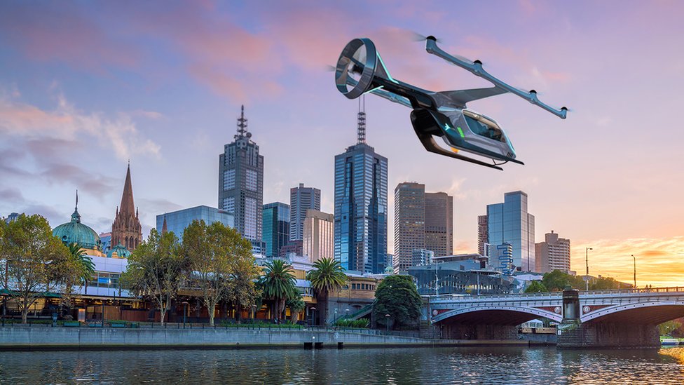 Изображение летающего такси Uber на фоне линии горизонта Мельбурна