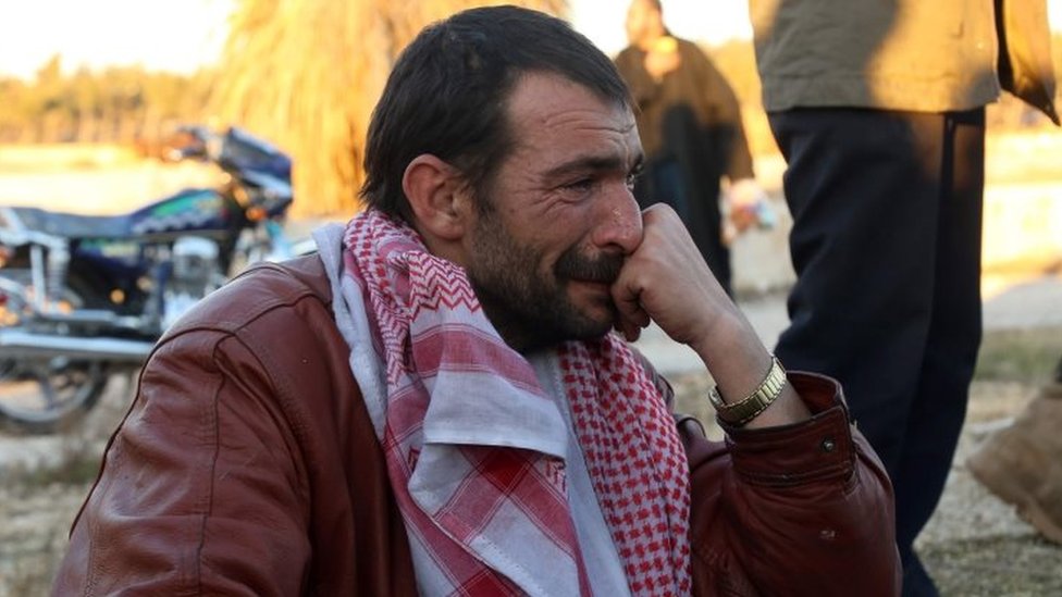 Сирийский мужчина плачет после эвакуации из восточного Алеппо. Фото: 15 декабря 2016 г.