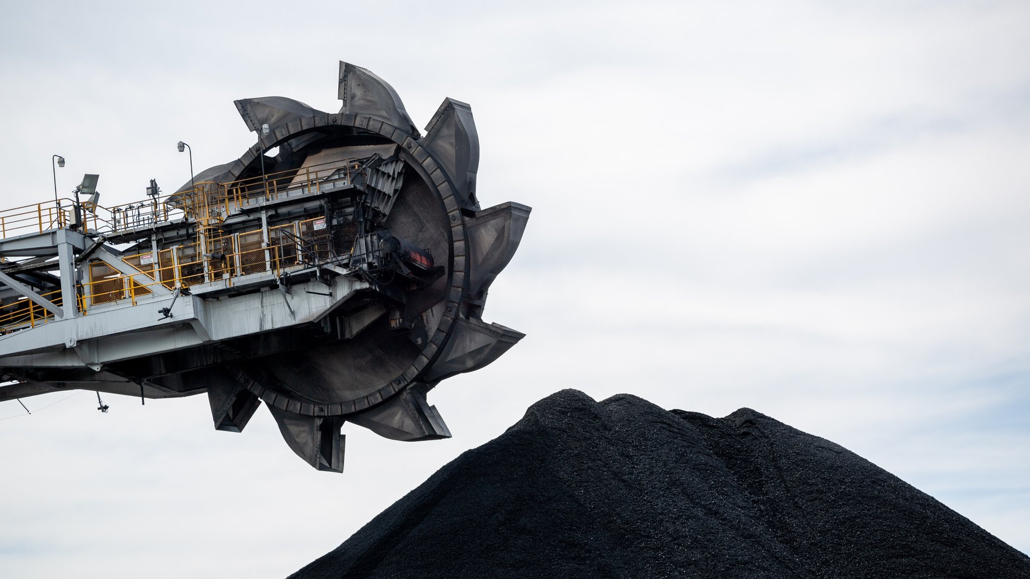 A pile of coal and a loading machine
