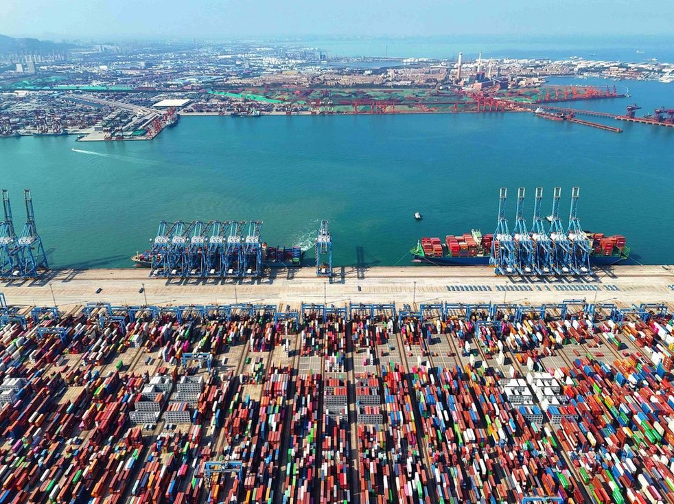Rail lifts shuttle cargo at a container yard at Qingdao Port in Shandong province, China, 11 October 2023
