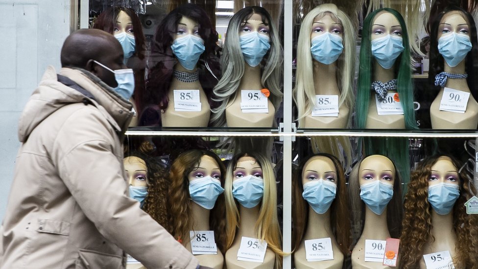 Masks on sale in a shop window, France