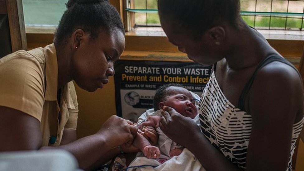 A child in Ghana receives a malaria vaccine