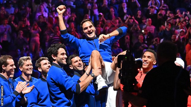 Roger Federer is hoisted aloft by his team-mates at the O2 Arena in London