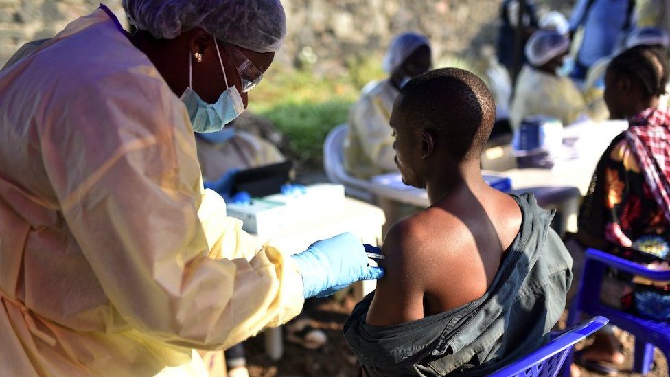 A Congolese health worker gives an Ebola vaccine to a man at the Himbi Health Centre in Goma, Democratic Republic of Congo, July 17, 2019