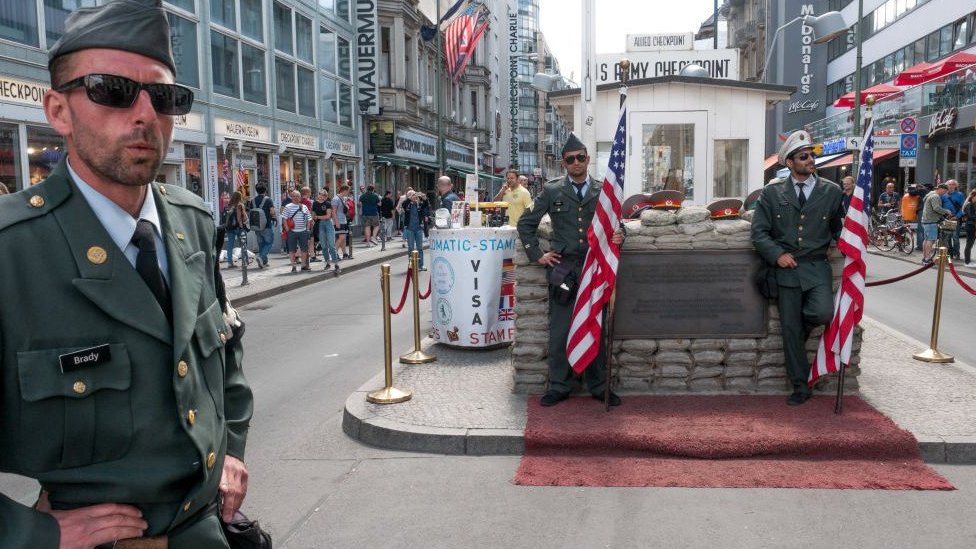 Performers posing as US soldiers at Checkpoint Charlie - 2018 photo
