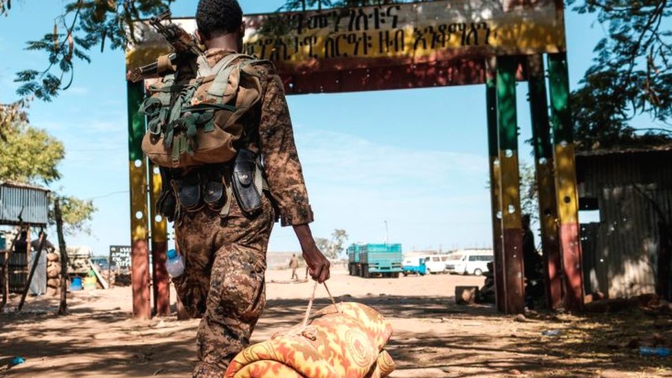 An Ethiopian solider carrying a mattress - November 2020