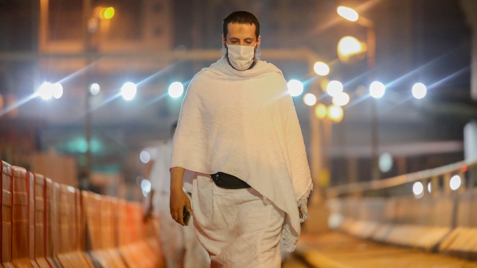 Muslim pilgrim wears a face mask during the Umrah pilgrimage on 3 October 2020