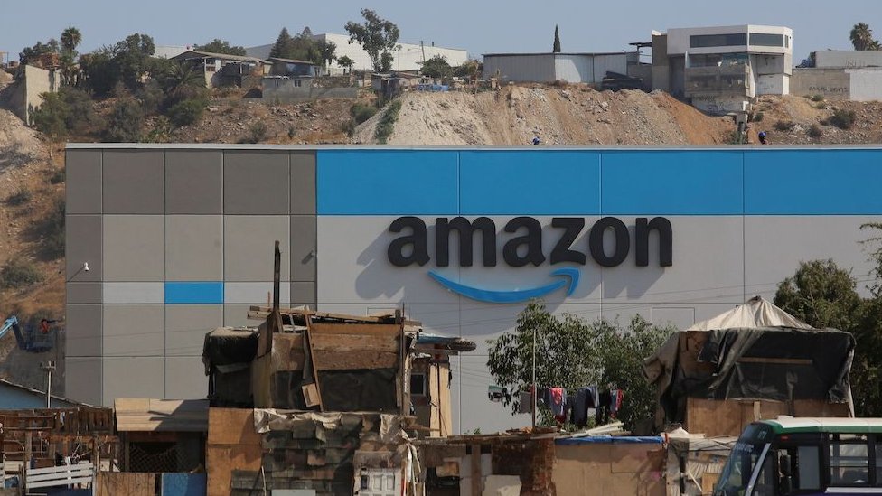 Shacks are seen at an informal settlement next the new Amazon fulfillment center, which is under construction at the RMSG Alamar Industrial Park, in Tijuana, Mexico September 7, 2021.