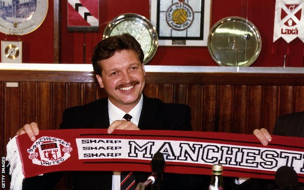 Michael Knighton poses with a Manchester United scarf