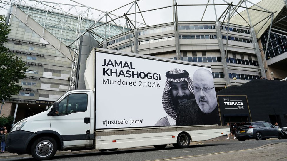 A van with a billboard showing Saudi Crown Prince Mohammed bin Salman (L) and murdered Saudi journalist Jamal Khashoggi (R) drives past St James' Park stadium in Newcastle (17 October 2021)