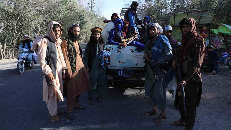 Taliban stand guard at a checkpoint as they took control of Herat, Afghanistan, 15 August 2021.