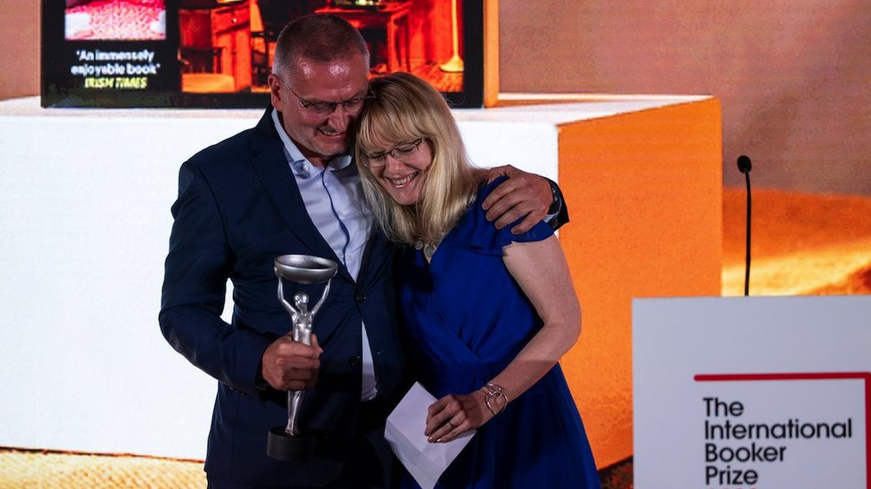 Bulgarian author Georgi Gospodinov (L) and translator Angela Rodel (R) react to winning the International Booker Prize for 'Time Shelter' at the International Booker Prize 2023 winner's ceremony in London, Britain, 23 May 2023.