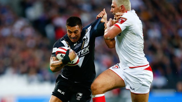 New Zealand's Dean Whare is tackled by England's Ryan Hall