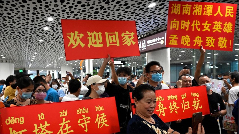 Supporters wait for the arrival of Huawei executive Meng Wanzhou at the Bao'an International Airport in Shenzhen on September 25, 2021.