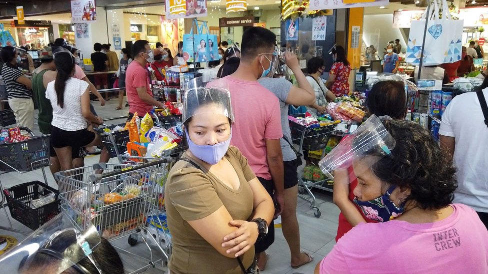 Residents in Legaspi, Albay province, in a busy supermarket on 31 October 2020