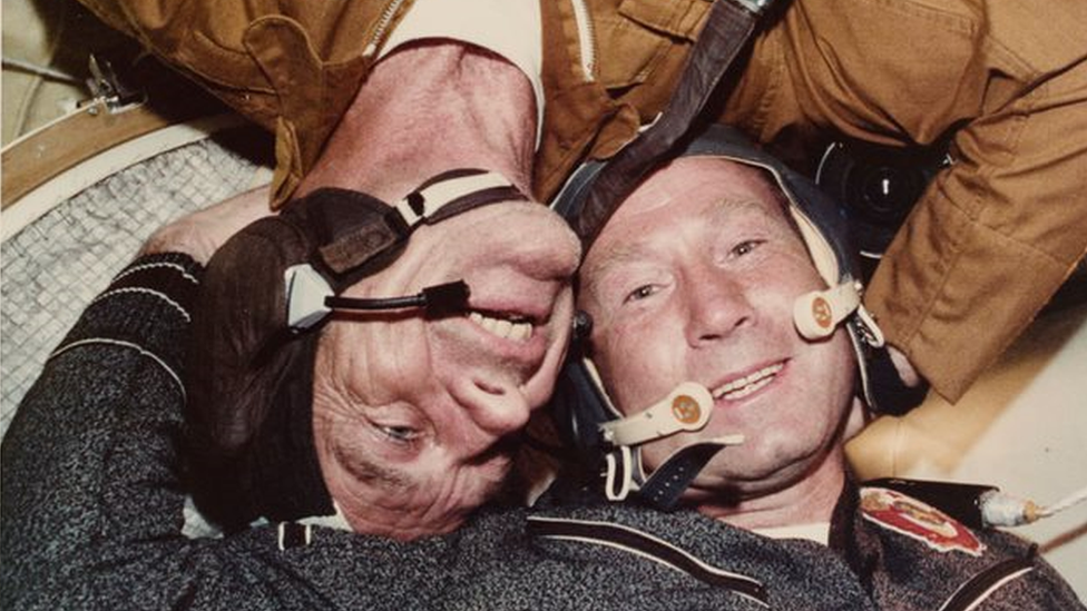 US astronaut Deke Slayton (upside down) shares a hug with Soviet cosmonaut Alexei Leonov in 1975