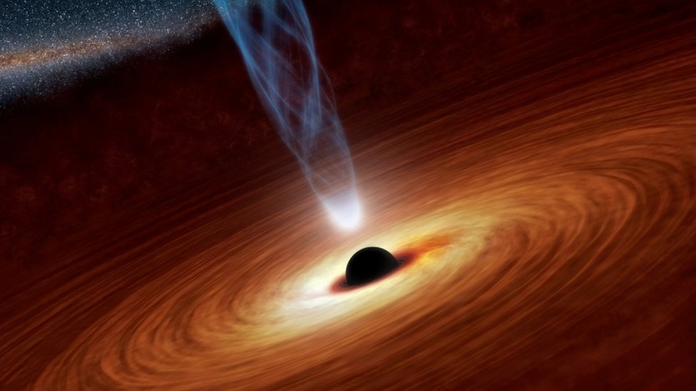 A supermassive black hole with millions to billions times the mass of our sun is seen in an undated NASA artist"s concept illustration. REUTERS/NASA/JPL-Caltech/Handout/File Photo