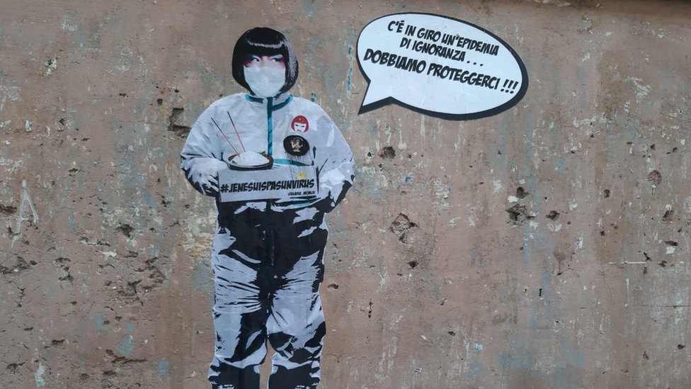 A view of a mural referring to the coronavirus outbreak that was created by the street artist Laika near Piazza Vittorio in the Chinese district of Rome, Italy, 4 February 2020