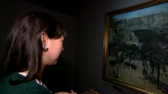 Lady viewing painting