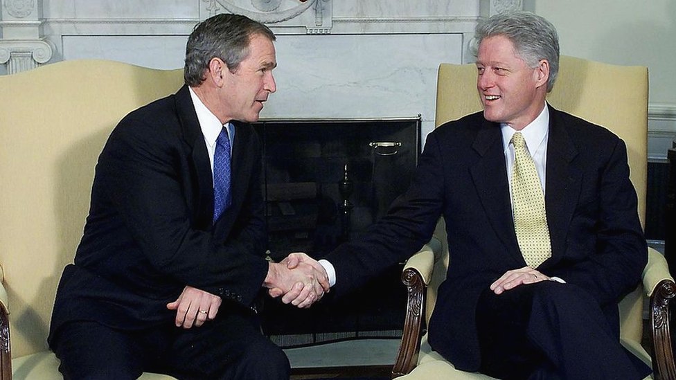 Presidents Clinton and George W Bush inside the White House