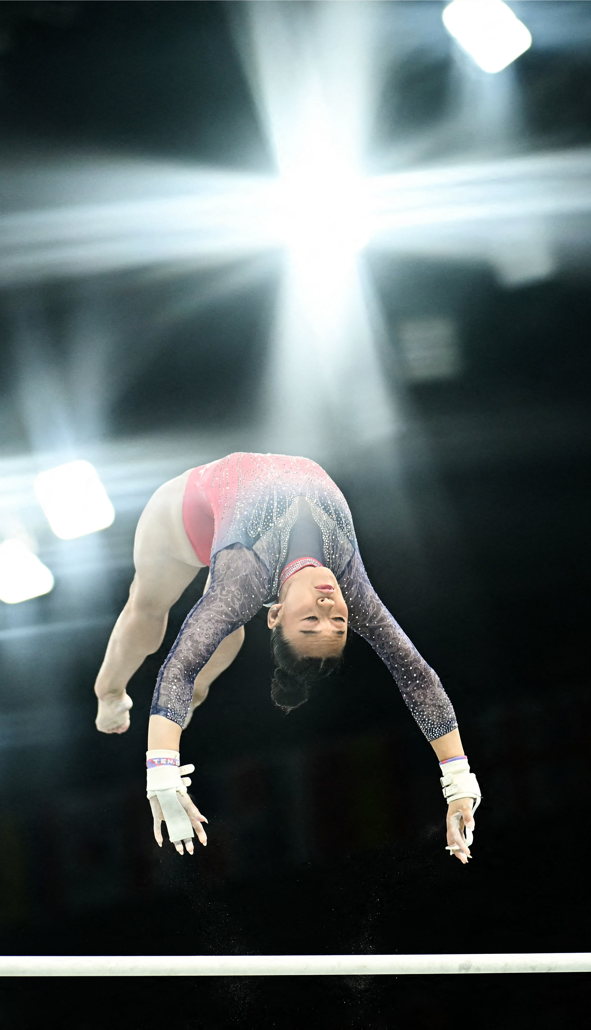 USA's Sunisa Lee competes in the uneven bars event of the artistic gymnastics