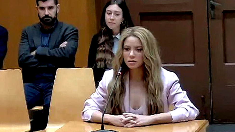 A handout video grab photo from the institutional video signal made available by the Superior Court of Justice of Catalonia (TSJC) shows Colombian singer Shakira (C) testifying at Barcelona Provincial Court in Barcelona city, Catalonia region, north-eastern Spain, 20 November 2023.