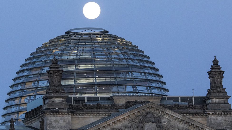 Supermoon shines over the Reichstag Building in Berlin, Germany