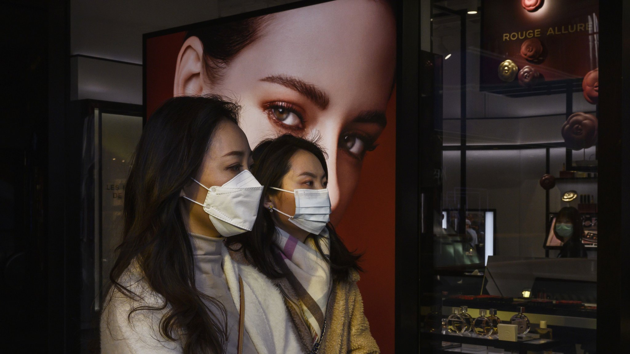Two women in a shopping center in Beijing.
