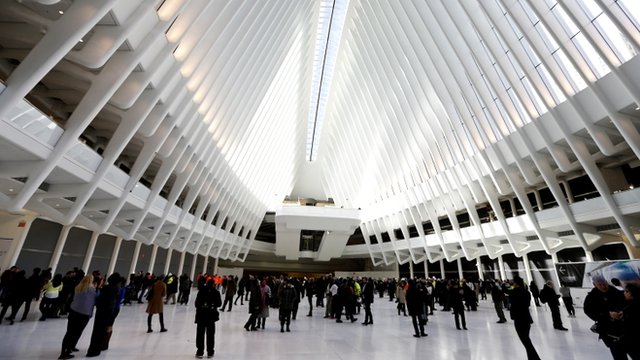 New Yorkers and tourists inside the hall of a newly opened station near the site of the 9/11 attacks