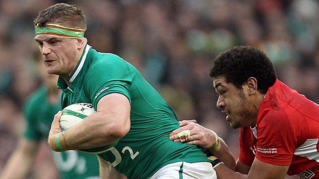 Taulupe Faletau tackles Jamie Heaslip during the 2012 Six Nations contest