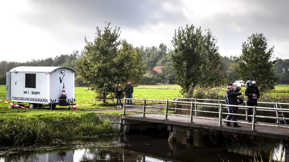 Police investigate a farm on the Buitenhuizerweg where a father and six children were living in Ruinerwold, the Netherlands, 16 October 2019