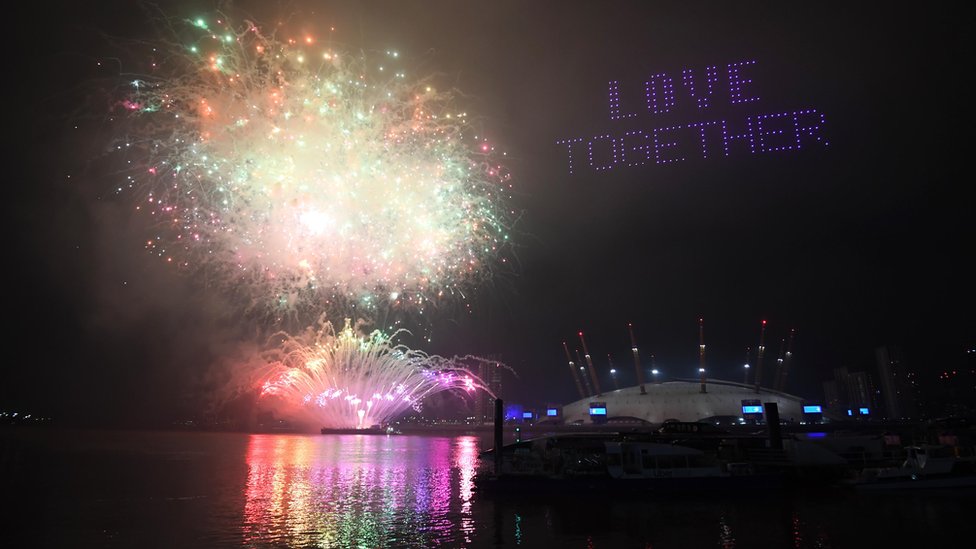 Fireworks and drones illuminate the night sky over the The O2 in London as they form a light display as London"s normal New Year"s Eve fireworks display was cancelled due to the coronavirus pandemic.