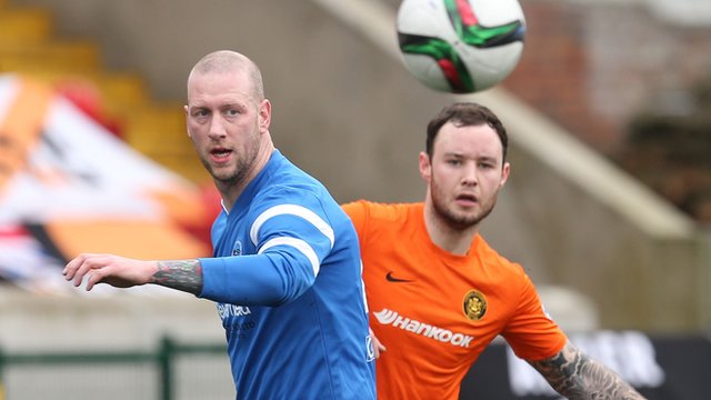 Action from Ballinamallard against Carrick Rangers