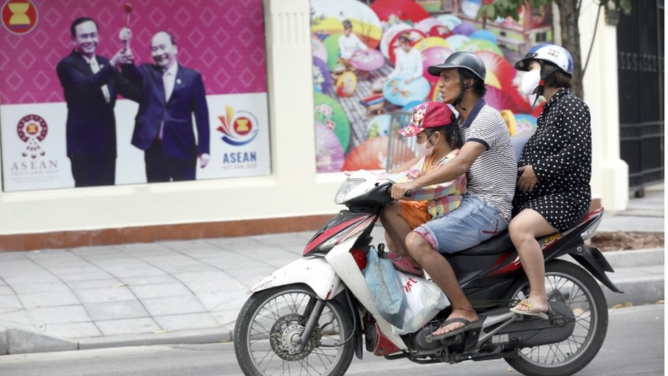 Family on a motorbike in Hanoi, Vietnam