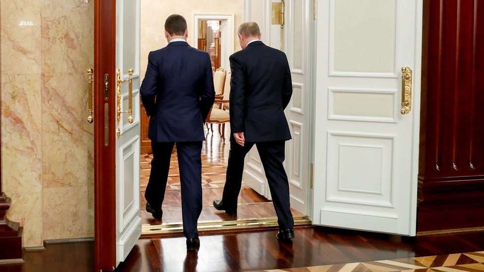 Russian President Vladimir Putin (R, back to camera) and Russian Prime Minister Dmitry Medvedev (L, back to camera) leave after a meeting with Cabinet members at Government headquarters in Moscow, Russia, 15 January 2020