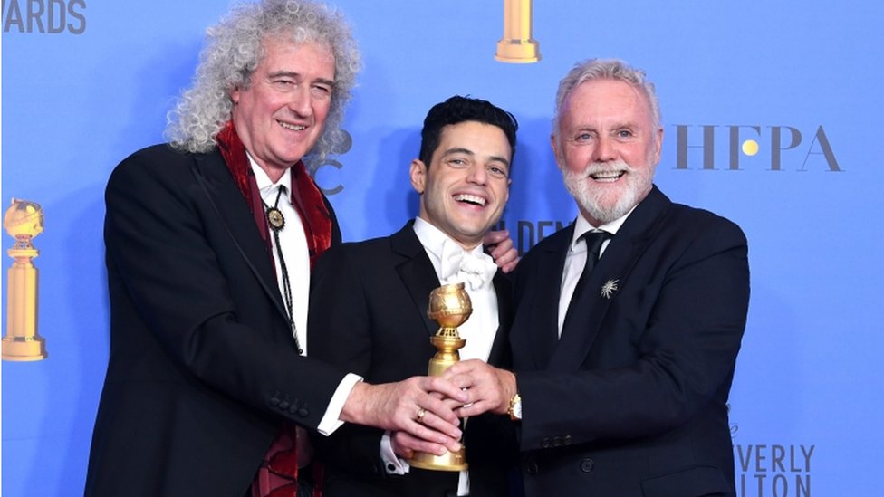 Brian May and Roger Taylor of Queen with Rami Malek