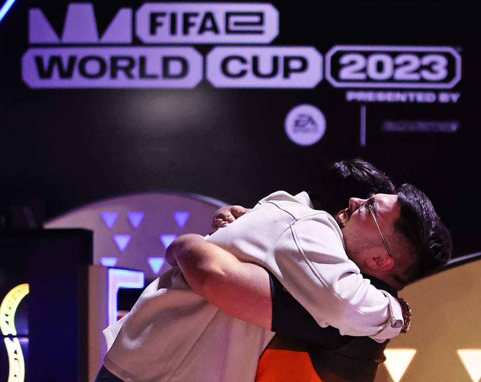 Hugging competitors at the FIFAe World Cup 2023 on July 18, 2023 in Riyadh, Saudi Arabia
