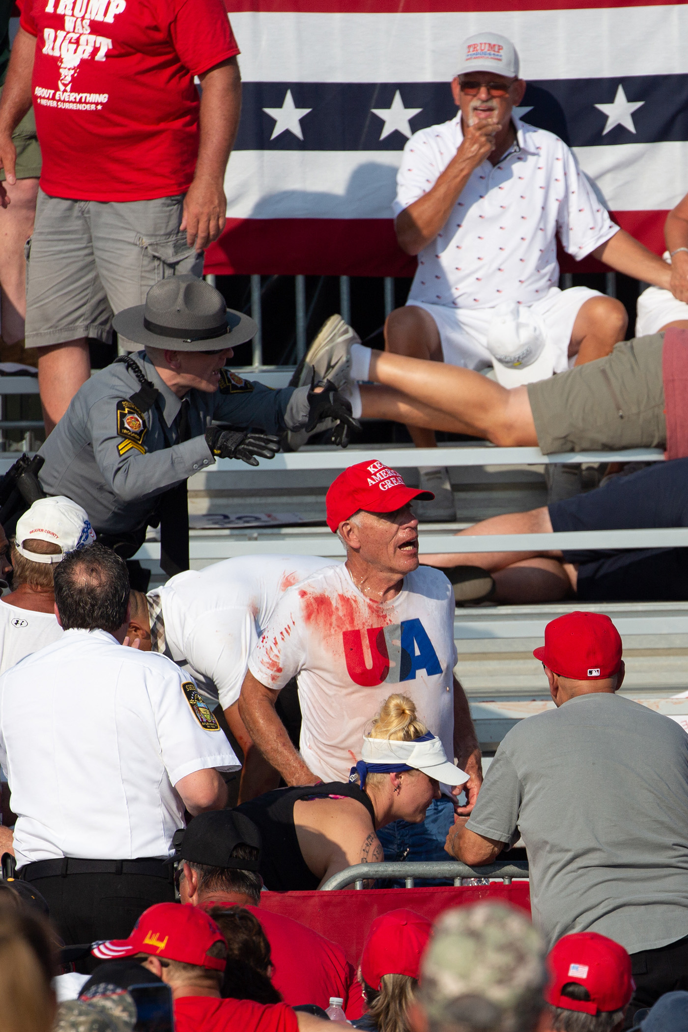 Spectators  - some covered in blood from helpingthe injured