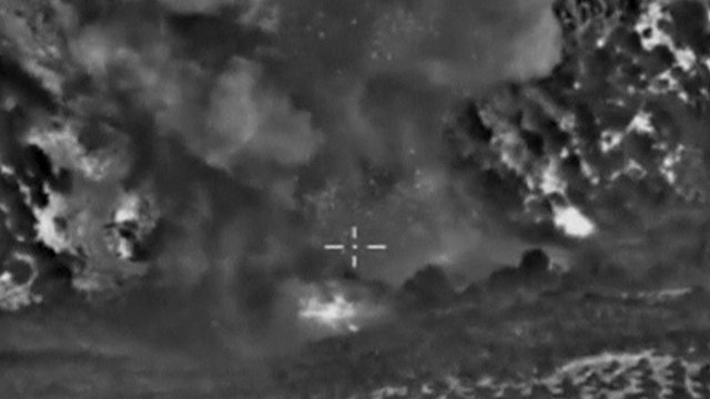 Screen grab of Russian Defence Ministry footage, purportedly showing smoke rising after air strikes on so-called Islamic State near Jisr al-Shughour in Idlib province