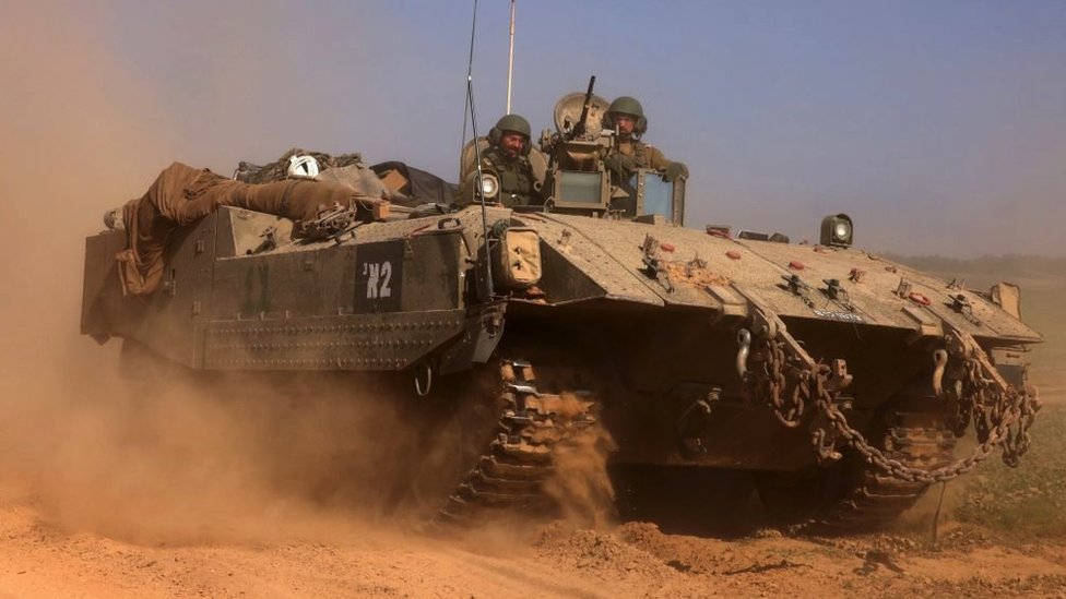 An Israeli tank advances in Gaza