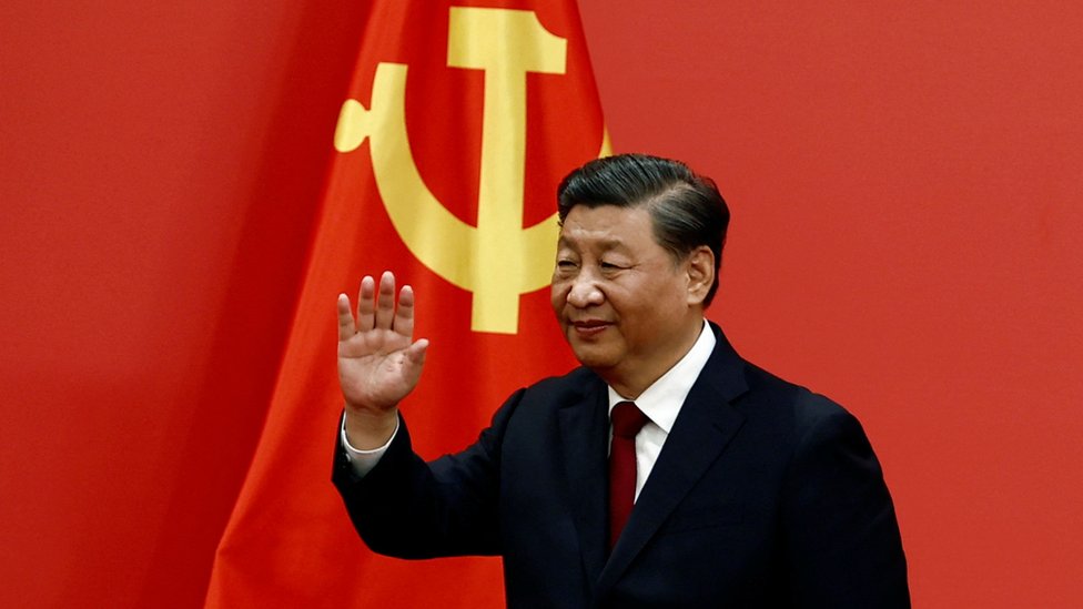 Xi Jinping waves after his speech as the new Politburo Standing Committee members meet the media following the 20th National Congress of the Communist Party of China, at the Great Hall of the People in Beijing, China October 23, 2022.