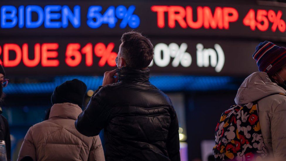 People gather in Times Square as they await election results on November 3, 2020 in New York City